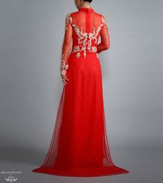 Custom made red Ao Dai with gold lace Materials: lace, sparkling pearl tulle, crystals Neckline: tall collar with beaded embellishment Long sleeves Closure: Zipper Chiffon pants Sweep train Red Wedding Dress With Sheer Bodice, Red Long Cheongsam For Wedding, Long Red Cheongsam For Wedding, Elegant Red Wedding Dress For Festive Occasion, Red Wedding Gown With Sheer Bodice, Elegant Red Ao Dai For Ceremonies, Red Long Sleeve Cheongsam For Wedding, Elegant Red Ao Dai For Ceremony, Red Long Sleeve Reception Dress