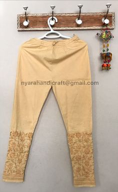 Comfortable and stretchable cotton ankle length pants with Lucknow Chikankari. This beautiful hand embroidered pants can be worn on any kurtis/ tunics. Cool and comfy ! Has a great stretch, fits most. Length:37.5 inches apprx Inseam- 26 inches apprx Embroidery designs may vary. Traditional Ankle-length Cotton Sets, Non-stretch Embroidered Cotton Pants, Cotton Chikankari Embroidery Straight Kurta Bottoms, Ankle-length Cotton Kurta With Zari Work, Fitted Cotton Churidar For Spring, Traditional Cotton Bottoms With Floral Embroidery, Cotton Straight Kurta Bottoms For Festive Season, Festive Cotton Straight Kurta Bottoms, Traditional Cotton Ankle-length Kurta