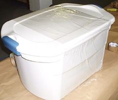 a large white container sitting on top of a wooden table