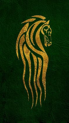 a green and gold lion logo on the side of a leather textured book cover