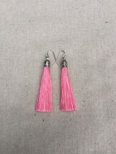 "Chic pink tassel earrings! They would add a pop of color to any outfit for any occasion. Dress them up or down. They are timeless and versatile. They are lightweight, fun and unique! The tassels measure 2 1/8\" long by 1/4\" wide. They hang from simple silver ear wire hooks. Overall drop length is about 2 1/4\". Metal is allergy free plated silver. These are my latest creation! I have them available in many colors! Find them all under the category tassel earrings in my shop. Thanks for stopping Pink Tassel Drop Earrings, Adjustable Pink Tassel Drop Earrings, Pink Adjustable Dangle Tassel Earrings, Pink Tassel Earrings As Gift, Trendy Pink Dangle Tassel Earrings, Pink Tassel Jewelry As A Gift, Pink Fringe Earrings For Summer, Summer Pink Fringe Earrings, Pink Dangle Tassel Earrings With Fringe