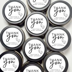 thank you baby shower favors in black and white with the words, thank you written on them