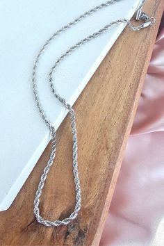 Elevate your style with our Silver Rope Necklace! Made from durable stainless steel, this 18 inch necklace is hypoallergenic and tarnish resistant. No need to worry about water ruining its shine. Stand out with this waterproof piece, perfect for any occasion.   Stainless steel  Hypoallergenic  Tarnish resistant  Waterproof  Made in USA Silver Minimalist Rope Chain Necklace As Gift, Minimalist Silver Rope Chain Necklace As Gift, Minimalist Silver Rope Chain Necklace For Gift, Silver Hypoallergenic Link Necklace, Trendy Silver Hypoallergenic Necklace, Trendy Hypoallergenic Silver Necklace, Silver Hypoallergenic Chain Necklace For Everyday, Everyday Silver Tarnish-resistant Chain Necklace, Everyday Silver Hypoallergenic Chain Necklace