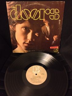 the doors album on display in a black case