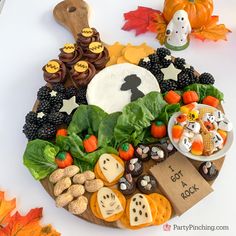 a platter filled with lots of different types of food on top of a table