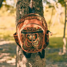 "This beautiful backpack showcase with an amazing piece of fabric woven by the HMONG hill tribes of Lanna Region (Northern Thailand). It has 3 zippered pockets and two unzippered on the sides. The straps are adjustable. We buy materials from Hmong market and we design and sew by hand. Some of the bags we modify to improve the product. The Hmong tribes live in the North of Thailand and have origins from the Tibetan area of China. You may not receive the exact bag picture here, As the fabric desig Traditional Backpack For Daily Use, Traditional Travel Backpack, Bohemian Handmade Travel Backpack, Bohemian Backpack For Festivals, Embroidered Backpack For Travel, Bohemian Backpack For Daily Use, Bohemian Standard Backpack For Daily Use, Embroidered Travel Backpack, Bohemian Brown Backpack