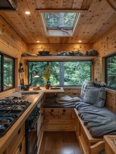 the interior of a tiny home with wood paneling and wooden flooring is shown