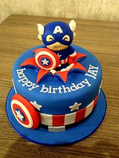 a birthday cake with captain america decorations on it