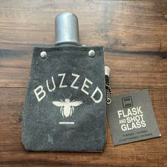 a flask bag with a buzzed logo on it