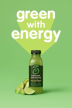 a bottle of green juice next to sliced limes on a green background with the words, green with energy