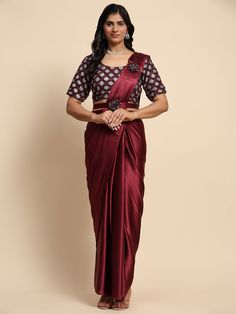 This exquisite ensemble features a maroon color satin pre-stitched saree paired with a matching satin blouse adorned with intricate zari work. The set also includes a designer belt for an added touch of sophistication.
Designed for convenience, the saree and blouse come fully stitched and ready to wear in sizes S to L, measuring 5.50 meters in total. The rich maroon color and elegant zari work make this designer saree a perfect choice for parties, festivals, and receptions.
Stand out in the crow Formal Festive Set With Unstitched Blouse, Festive Satin Pre-draped Saree, Silk Choli For Formal Eid Occasion, Festive Satin Pre-draped Saree For Formal Occasions, Formal Unstitched Blouse Sets For Navratri, Formal Sets With Unstitched Blouse For Navratri, Formal Bollywood Art Silk Choli, Formal Bollywood Style Art Silk Choli, Elegant Satin Sets With Unstitched Blouse