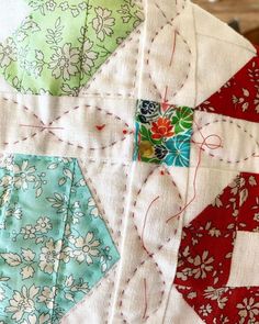 a close up view of a quilt on a table