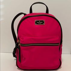 Kate Spade Small Bradley Backpack Details: Size: 11" H X 9" W Color (S): Radish, Hot Pink, Black, Gold Nwt Inside Pocket + Zippered Interior Pocket Fully Lined Adjustable Straps ______________________________ No Trades / No Returns Or Exchanges Tags: Small Back Pack / School / Leather / Nylon / New York Kate Spade Pink Bag With Zipper Closure, Pink Backpack For Errands, Jansport Backpack, Kate Spade Bag, School Backpacks, Pink Black, Inside Pocket, Fashion Backpack, Hot Pink