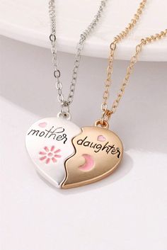 This magnetic heart necklace set is perfect for moms and daughters to show their love for each other. The two pieces fit perfectly together and can be easily separated, just like the bond between a mother and daughter. Crafted with a stylish white design, this necklace set will make a heartwarming gift for any special occasion. Mother Daughter Necklaces Set, Mother Daughter Necklace, Formal Wear Dresses, Daughter Necklace, Everyday Accessories, Mother And Daughter, Heartfelt Gifts, Matching Necklaces, Letter Patterns