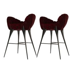 two red velvet bar stools with metal legs