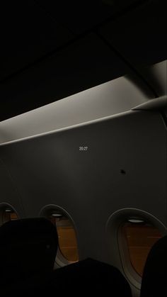 the interior of an airplane with two seats and one window that says tetd