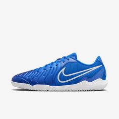 the nike zoom tennis shoe is blue and white