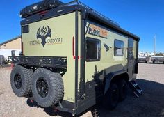 an off road vehicle parked in a parking lot