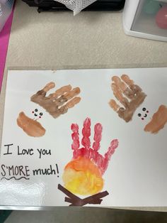 a child's handprint is displayed on a white paper with the words i love you smore much