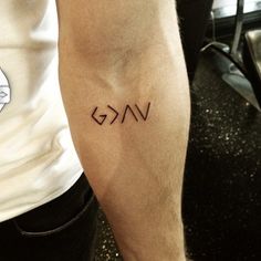 a man with a tattoo on his arm that reads vg and has the word vg written across it