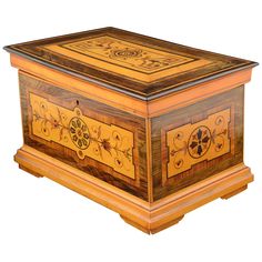 a wooden box with decorative designs on it