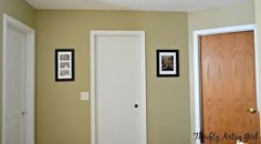 two doors are open in the corner of a room with pictures on the wall and below them