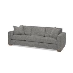 a gray couch with two pillows on it