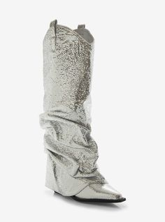 These wedge boots are must-have statement pieces for any fashion-forward enthusiast. With its textured metallic silver design and western-inspired details  these boots are sure to turn heads. The added scrunched fold over accent and black sole add an extra touch of style.Listed in women's sizes.Heel: 2 34''Metallic synthetic upper; synthetic soleImported Fall Party Boots With Wedge Heel, Trendy Silver Summer Boots, Fold Over Boots, Boot Bling, Azalea Wang, Bee And Puppycat, Blue Beetle, Silver Design, Wedge Boots