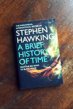 the book stephen hawking a brief history of time by stephen hawking on a wooden table