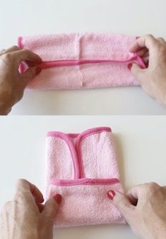 someone is making a towel holder out of pink material