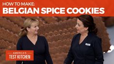 two women standing next to each other in front of cookies