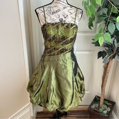 Show Off Those Shoulders And Legs At Your Next Cocktail Event With This Green Strappy Bubble Hem Cocktail Dress With Lace And Sequin Embellished Torso By Fiesta In Size Medium. Nwt. Pair With Heels And A Shawl. Perfect For Attending Weddings, Homecoming, Prom, And Other Cocktail Events. Details: Spaghetti Straps Back Zip Closure Bubble Hem Lined Square Neckline Sequin And Lace Torso Satin Material On Skirt Falls Just Above The Knee Nwt, Never Worn Approximate Measurements (Taken Flat): Chest (Pi Cocktail Dress Green, Hoco Inspo, Fiesta Dress, Lace Cocktail Dress, Bubble Hem, Bubble Skirt, Cocktail Event, Cocktail Dress Lace, Fall Skirts