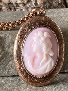 A gorgeous vintage oval Cameo  gold locket , stunning crisp hand engraving to the border, traditional floral flowing design , beautifully made with a hidden hinge, in the centre a wonderful Angel Skin shell cameo coral/conch 25mm x 19mm , overall size of 45mm high including the top ring , 27mm wide, on an antique Belchur chain 50cm long with a traditional barrel snap , total weight of 16.6gm Onyx Signet Ring, Peridot Pendant, Top Rings, Victorian Gold, Gold Locket, Natural Jade, Silver Engraving, Silver Lockets, Locket Necklace