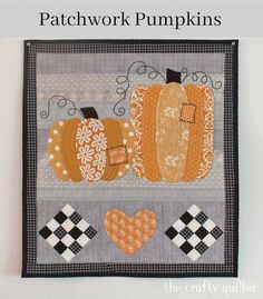 patchwork pumpkins are featured in this quilted appliqued wall hanging