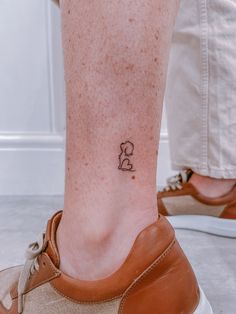 a person with a small tattoo on their foot