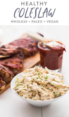 healthy coleslaw salad in a white bowl on a cutting board with bbq sauce