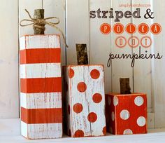 three wooden blocks with polka dot pumpkins painted on them and tied to each other