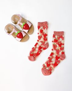 Heart-shaped pink and red strawberries interspersed with playful daisies make these strawberry socks the perfect addition to your Valentine's Day, Spring, and Summer outfits. Set against white sheer fabric for maximum color pop with a ruffle cuff for ultra sweetness. NOW AVAILABLE IN 2 SIZES (please select your size from the dropdown below): Size I - Fits US W5.5-10 Size II - Fits US W10.5-14/US M8.5-12 For size 5 or below, try kids size. 200 Needle Count. ✨ Funky yet elegant - no silly or child Trendy Red Socks For Summer, Sweet Pink Socks For Gifts, Pink Sweet Socks For Spring, Pink Socks For Spring, Casual Summer Socks As Gift, Casual Summer Socks For Gift, Casual Summer Socks For Gifts, Playful Summer Socks As A Gift, Playful Summer Socks For Gifts