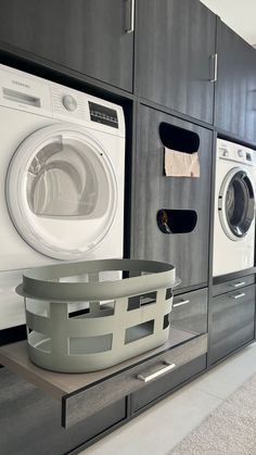 a washer and dryer are on display in a laundry room