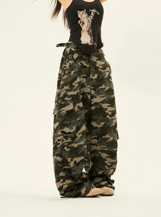 Embrace the essence of street style with our Camouflage Cargo Trousers, featuring bold double side belt straps for a blend of function and flair. Crafted from a soft yet durable blend of 95% cotton and 5% polyester fiber, these pants are tailored to thrive in your everyday wardrobe rotation. The classic camouflage pattern exudes a retro vibe, while multiple pockets and the loose fit cut ensure they are as practical as they are fashionable. Pair these trousers with a tucked-in basic tee and chunk Camo Pants Metalhead, Army Pants Aesthetic, Baggy Cargo Pants Outfit, Baggy Camo Pants, Camouflage Pants Outfit, Black Camo Pants, Emo Pants, Camoflauge Pants, Cargo Camo Pants