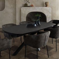 a dining room table with chairs around it