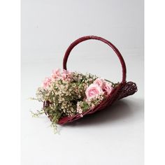 a basket filled with flowers sitting on top of a table