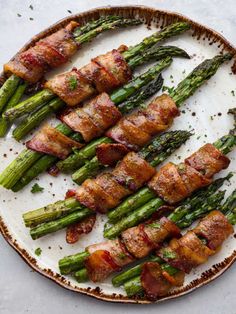 asparagus wrapped in bacon on a plate