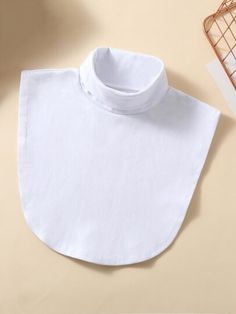 a white bib laying on top of a table