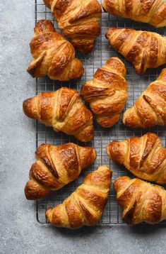 freshly baked croissants on a cooling rack ready to be served in the oven