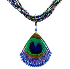 a multicolored necklace with a peacock's wing hanging from the front and side