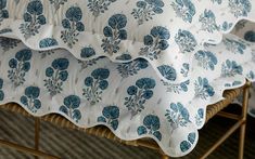 blue and white floral bedding on a bamboo slatted bed with matching pillow cases