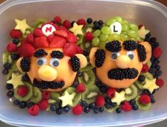 there are some fruit in the shape of characters on top of each other with eyes and nose