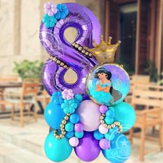 an air filled balloon with the number eight on it's side and balloons in the shape of princesses