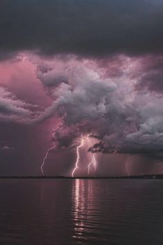 an image of storm clouds and lightning with the words why? written in pink on it